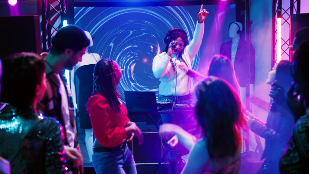 Happy people attending disco party
